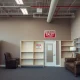 Bankrupt furniture chain store closure with liquidation sale signs and empty showroom