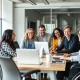 Diverse team including disabled employees collaborating successfully in modern office environment