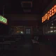 Empty burger chain restaurant with closed sign after sudden shutdown