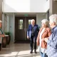 Professional condominium management services team assisting residents in modern community setting