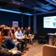 University students pitching at social enterprise competition in modern London venue