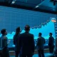 Financial analysts reviewing 2026 market forecast data showing 10% growth projection