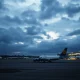 A major airline files for Chapter 11 bankruptcy protection on a quiet airport tarmac.