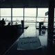 Airline shutdown after license revocation leaves passengers stranded at empty check-in counter.