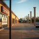 Empty furniture store with closing sign marks the end of a 73-year retail chain, leaving customers upset.