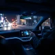 Waymo Gemini AI assistant interface inside a futuristic autonomous vehicle cabin.