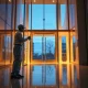 ABM Industries commercial cleaning services professional at work in office building lobby