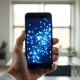 Smartphone displaying AI neural network visualization representing 2026 data on AI app retention and churn.