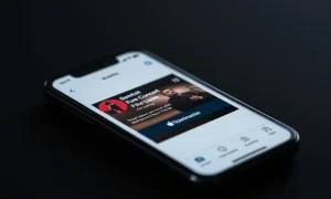 Apple Music app on a phone showing Ticketmaster concert listings and ticket links.