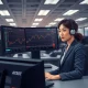 Trader analyzing AUD/JPY surge on Bloomberg Terminal after Bank of Japan policy signal.