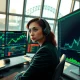 Forex trader monitoring AUD/USD surge as RBA rate hike expectations grow