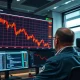 Bitcoin price chart showing a drop below $71,000 on a financial trading monitor.