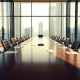 Boardroom scene representing pressure on Edinburgh Worldwide Investment Trust from activist Boaz Weinstein.