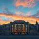 Bank of Canada headquarters in Ottawa as central bank holds front-end rates steady amid geopolitical conflict.