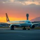 A Cathay Pacific aircraft at Hong Kong airport as analysts raise the stock's price target.