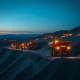 Centerra Gold's Mount Milligan open-pit mine operational at dusk, representing the company's production scale.