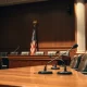 A formal congressional hearing room with witness table and microphones, representing upcoming crypto regulation discussions.