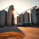 Corn futures market analysis with grain elevator representing agricultural commodity trading