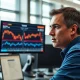 A trader monitors sugar and crude oil futures prices on financial market screens.