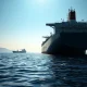 Oil tanker halted in Strait of Hormuz during Iran conflict causing crude prices to surge.