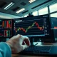 Financial trading desk with monitors showing US dollar currency charts and market data.