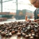 Cocoa beans on a table with market charts in background, illustrating cocoa futures volatility.
