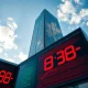 ECB Eurotower in Frankfurt with stock ticker, representing market reaction to oil shock and hawkish signals.
