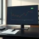 Professional trading desk with monitor showing ELF stock chart and options contract, illustrating the e.l.f. Beauty options strategy.
