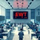 Trading floor in Taipei showing the EWT ETF ticker with red downward arrows indicating a significant capital outflow.