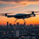 An eVTOL flying taxi hovers above a city at dusk following FAA approval for tests in 26 states.
