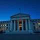 Federal Reserve building in Washington D.C. representing cautious monetary policy stance on inflation risks in 2026.