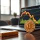 Gold bar and Bitcoin hardware wallet on a desk with market charts.
