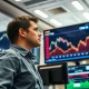 Commodities trader analyzes rising lean hog futures data on screen following USDA report.