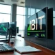 IBIT ETF ticker display showing significant weekly inflow data on a modern trading desk
