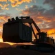 Industrial gold mining operation at sunset representing Idaho Strategic Resources.