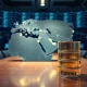 Global energy crisis map with oil barrel representing IEA historic reserve release affecting stock markets