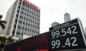 Bank Indonesia headquarters with rising oil prices threatening monetary policy easing plans.