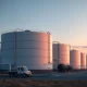 Strategic oil storage tanks at a facility following the Japan and Germany oil reserves release announcement.