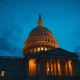 U.S. Capitol building at dusk, representing legislative action on defense and democracy.