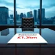 Document showing the £1.3bn creditor shortfall from the MFS financial services collapse on a boardroom table.