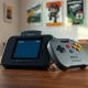 ModRetro Chromatic handheld and Nintendo 64 controller representing Palmer Luckey's retro gaming expansion.