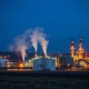 Natural gas processing facility at coastal export terminal during evening operations