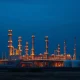 Natural gas processing facility at dusk as energy markets react to Iran conflict and Strait of Hormuz threats