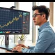 Financial analyst examines NOK currency charts showing temporary strength according to Nordea forecast