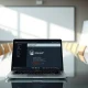 Laptop showing ChatGPT interface with a paused notification, representing OpenAI's strategic shift.