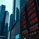 A digital display shows the Chinese yuan exchange rate in a financial district.