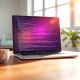 Replit's vibe-coding platform interface glowing on a laptop screen, representing its $9 billion valuation milestone.