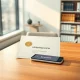 Official UK banking licence document next to a Revolut app phone, symbolizing Revolut's regulatory approval.