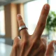 Sandbar Stream AI note-taking ring worn on a hand, demonstrating its use for voice-activated notes.