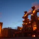 Steel mill operations with molten metal, representing Steel Dynamics' strong earnings forecast.